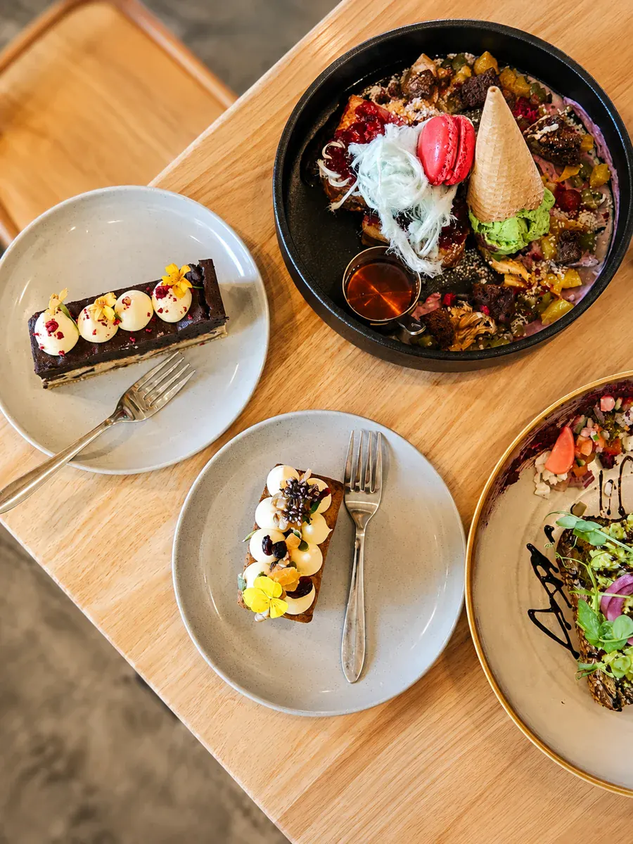 Colourful dishes and desserts served at Not typical